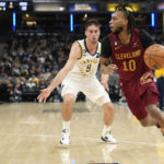 
              Cleveland Cavaliers guard Darius Garland (10) drives around Indiana Pacers guard T.J. McConnell (9) during the first half of an NBA basketball game in Indianapolis, Thursday, Dec. 29, 2022. (AP Photo/AJ Mast)
            
