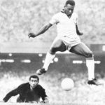 
              FILE - Brazil's Pele scores past Venezuela's goal keeper Fabrizio Fasano in Rio de Janeiro, Brazil, Aug. 24, 1969. Pelé, the Brazilian king of soccer who won a record three World Cups and became one of the most commanding sports figures of the last century, died in Sao Paulo on Thursday, Dec. 29, 2022. He was 82. (AP Photo, File)
            