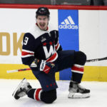
              Washington Capitals defenseman Dmitry Orlov (9) celebrates after his goal during overtime of an NHL hockey game against the Detroit Red Wings, Monday, Dec. 19, 2022, in Washington. (AP Photo/Nick Wass)
            
