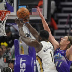 
              Utah Jazz forward Kelly Olynyk (41) guards New Orleans Pelicans forward Zion Williamson (1) as he goes to the basket during the first half of an NBA basketball game Thursday, Dec. 15, 2022, in Salt Lake City. (AP Photo/Rick Bowmer)
            