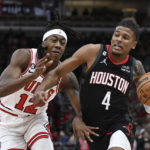 
              Houston Rockets guard Jalen Green (4) drives to the basket against Chicago Bulls guard Ayo Dosunmu (12) during the first half of an NBA basketball game Monday, Dec. 26, 2022, in Chicago. (AP Photo/Quinn Harris)
            
