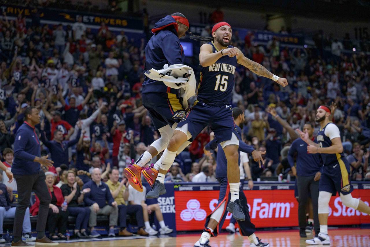 New Orleans Pelicans guard Jose Alvarado (15), right, celebrates a three point basket with New Orle...