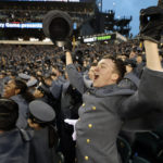 
              Army Cadet Cpl. Andrew Sanchez, of Carmel, Ind., celebrates when Army takes the lead 7-3 in the second quarter of an NCAA college football game in Philadelphia, Saturday, Dec. 10, 2022. (Elizabeth Robertson/The Philadelphia Inquirer via AP)
            