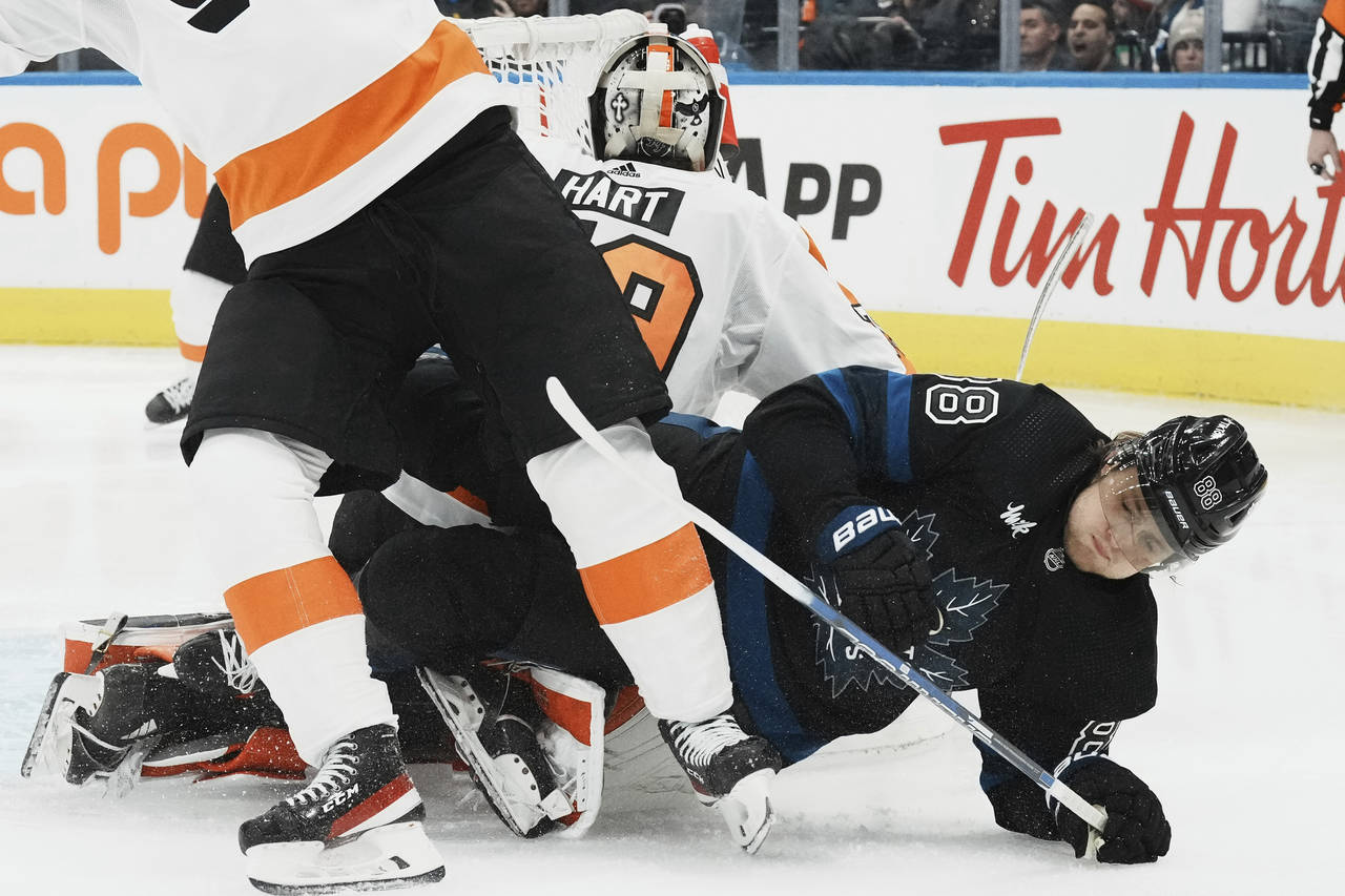 Toronto Maple Leafs right wing William Nylander (88) falls to the ice near Philadelphia Flyers goal...
