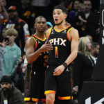 
              Phoenix Suns guard Chris Paul (3) embraces guard Devin Booker after Booker made a basket during the second half of an NBA basketball game against the New Orleans Pelicans, Saturday, Dec. 17, 2022, in Phoenix. The Suns defeated the Pelicans 118-114. (AP Photo/Matt York)
            