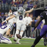 
              Kansas State's Ty Zentner kicks a field goal past TCU linebacker Shadrach Banks (19) in overtime of the Big 12 Conference championship NCAA college football game, Saturday, Dec. 3, 2022, in Arlington, Texas. Holding is Jack Blumer. (AP Photo/LM Otero)
            