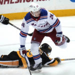 
              New York Rangers' Kaapo Kakko (24) looks for the puck after a collision with Pittsburgh Penguins' Jake Guentzel (59) during the first period of an NHL hockey game in Pittsburgh, Tuesday, Dec. 20, 2022. (AP Photo/Gene J. Puskar)
            