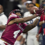 
              North Carolina Central Eagles wide receiver E.J. Hicks catches a pass during the second half of the Celebration Bowl NCAA college football game Jackson State, Saturday, Dec. 17, 2022, in Atlanta. (AP Photo/Hakim Wright Sr. )
            