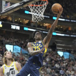 
              Indiana Pacers forward Jalen Smith (25) goes to the basket as Utah Jazz forward Kelly Olynyk (41) defends during the first half of an NBA basketball game Friday, Dec. 2, 2022, in Salt Lake City. (AP Photo/Rick Bowmer)
            