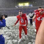 
              Buffalo Bills place kicker Tyler Bass (2) walks off the field after kicking a game-winning field goal during the second half of an NFL football game against the Miami Dolphins in Orchard Park, N.Y., Saturday, Dec. 17, 2022. The Bills won 32-29. (AP Photo/Adrian Kraus)
            