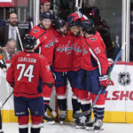 
              CORRECTS TO SECOND PERIOD NOT FIRST - Washington Capitals defenseman Erik Gustafsson, center, celebrates with defenseman John Carlson (74), right wing Anthony Mantha, center Evgeny Kuznetsov (92), and left wing Sonny Milano (15) after scoring against the Toronto Maple Leafs during the second period of an NHL hockey game, Saturday, Dec. 17, 2022, in Washington. (AP Photo/Jess Rapfogel)
            