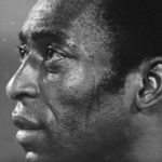 
              FILE - Soccer star Pele, of the New York Cosmos, listens to the star-spangled banner prior to a playoff game between the Cosmos and the Rochester Lancers in Giants Stadium, East Rutherford, New Jersey, Aug. 24, 1977.  Pelé, the Brazilian king of soccer who won a record three World Cups and became one of the most commanding sports figures of the last century, died in Sao Paulo on Thursday, Dec. 29, 2022. He was 82.  (AP Photo/Ray Stubblebine, File)
            