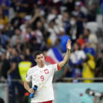 
              Poland's Robert Lewandowski waves after the World Cup round of 16 soccer match between France and Poland, at the Al Thumama Stadium in Doha, Qatar, Sunday, Dec. 4, 2022. (AP Photo/Natacha Pisarenko)
            