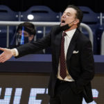 
              FILE - Iona head coach Rick Pitino gestures as his team plays against Alabama in the first half of a first-round game in the NCAA college basketball tournament in Indianapolis, March 20, 2021. University of New Mexico coach Richard Pitino says the upcoming matchup Sunday, Dec. 18, 2022, against Iona is business as usual for the unbeaten Lobos. He still acknowledges the game is getting added exposure because it pits him against his father, Rick. (AP Photo/Michael Conroy, File)
            