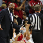 
              Indiana head coach Mike Woodson, left, talks to a referee during the second half of an NCAA college basketball game against Rutgers in Piscataway, N.J., Saturday, Dec. 3, 2022. (AP Photo/Noah K. Murray)
            