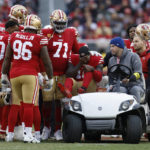 
              San Francisco 49ers wide receiver Deebo Samuel, middle, reacts as he is carted off the field during the first half of an NFL football game against the Tampa Bay Buccaneers in Santa Clara, Calif., Sunday, Dec. 11, 2022. (AP Photo/Jed Jacobsohn)
            
