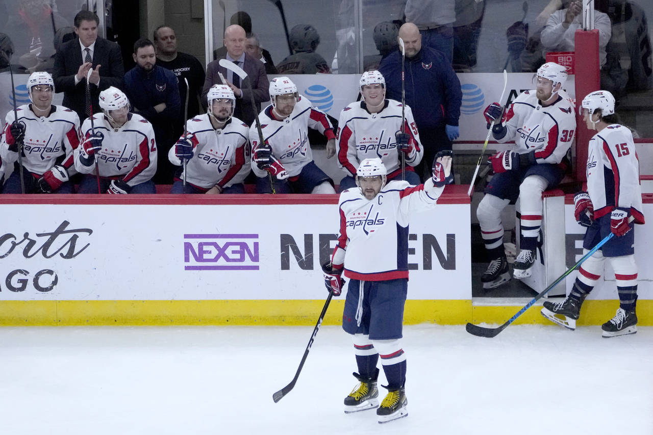Washington Capitals' Alex Ovechkin acknowledges the crowd's applause after scoring his 800th career...