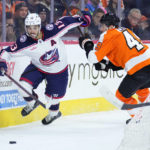 
              Columbus Blue Jackets' Johnny Gaudreau, left, tries to get past Philadelphia Flyers' Noah Cates during the third period of an NHL hockey game, Tuesday, Dec. 20, 2022, in Philadelphia. (AP Photo/Matt Slocum)
            