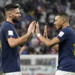
              France's Olivier Giroud, left, and France's Kylian Mbappe celebrate after scoring their side's second goal during the World Cup round of 16 soccer match between France and Poland, at the Al Thumama Stadium in Doha, Qatar, Sunday, Dec. 4, 2022. (AP Photo/Martin Meissner)
            
