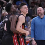 
              Miami Heat guard Tyler Herro, right, celebrates with teammate, Victor Oladipo, left, after the Miami Heat defeated the Oklahoma City Thunder in an NBA basketball game Wednesday, Dec. 14, 2022, in Oklahoma City. (AP Photo/Sue Ogrocki)
            