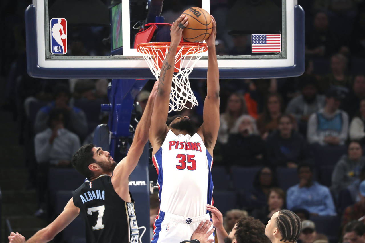 Detroit Pistons forward Marvin Bagley III (35) shoots while defended by Memphis Grizzlies forward S...