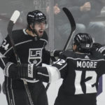 
              Los Angeles Kings center Phillip Danault (24) celebrates with left wing Trevor Moore (12) after scoring during the third period of an NHL hockey game against the Calgary Flames Thursday, Dec. 22, 2022, in Los Angeles. (AP Photo/Ashley Landis)
            