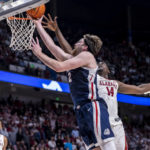 
              Gonzaga forward Drew Timme (2) gets past Alabama center Charles Bediako (14) for a basket during the second half of an NCAA college basketball game, Saturday, Dec. 17, 2022, in Birmingham, Ala. (AP Photo/Vasha Hunt)
            
