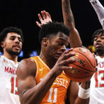 
              Maryland forward Patrick Emilien (15) and guard Hakim Hart (13) attempt to block Tennessee forward Tobe Awaka (11) during the first half of an NCAA college basketball game in the Basketball Hall of Fame Invitational, Sunday, Dec. 11, 2022, in New York. (AP Photo/Julia Nikhinson)
            