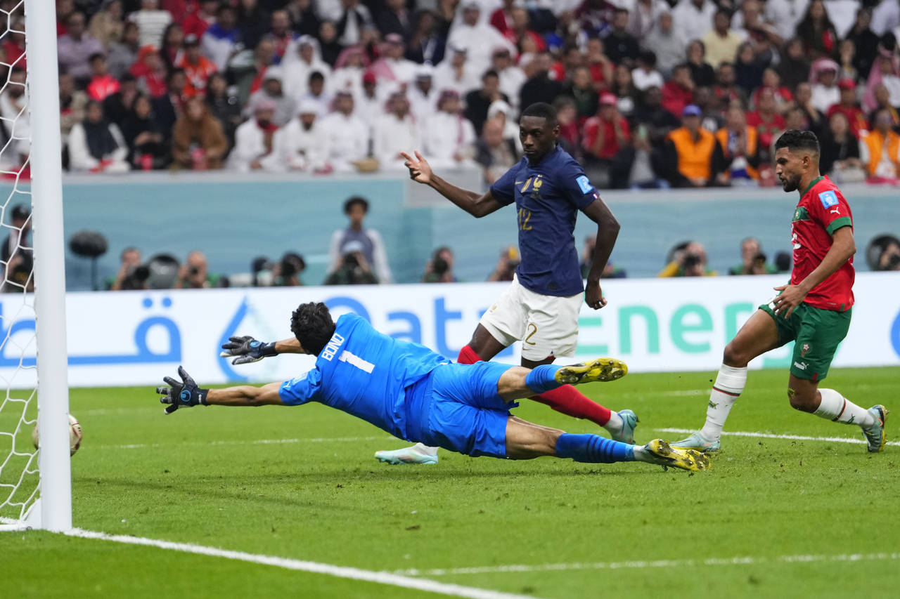 France's Randal Kolo Muani scores his side's second goal during the World Cup semifinal soccer matc...