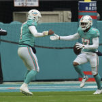 
              Miami Dolphins wide receiver Jaylen Waddle (17), right, celebrates with Miami Dolphins quarterback Tua Tagovailoa (1) after scoring a touchdown during the first half of an NFL football game, Sunday, Dec. 25, 2022, in Miami Gardens, Fla. (AP Photo/Jim Rassol)
            