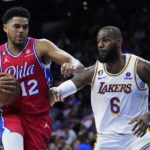 
              Philadelphia 76ers' Tobias Harris, left, tries to get past Los Angeles Lakers' LeBron James during the first half of an NBA basketball game, Friday, Dec. 9, 2022, in Philadelphia. (AP Photo/Matt Slocum)
            