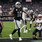 
              Las Vegas Raiders wide receiver Mack Hollins celebrates after a touchdown reception during the first half of an NFL football game between the New England Patriots and Las Vegas Raiders, Sunday, Dec. 18, 2022, in Las Vegas. (AP Photo/John Locher)
            