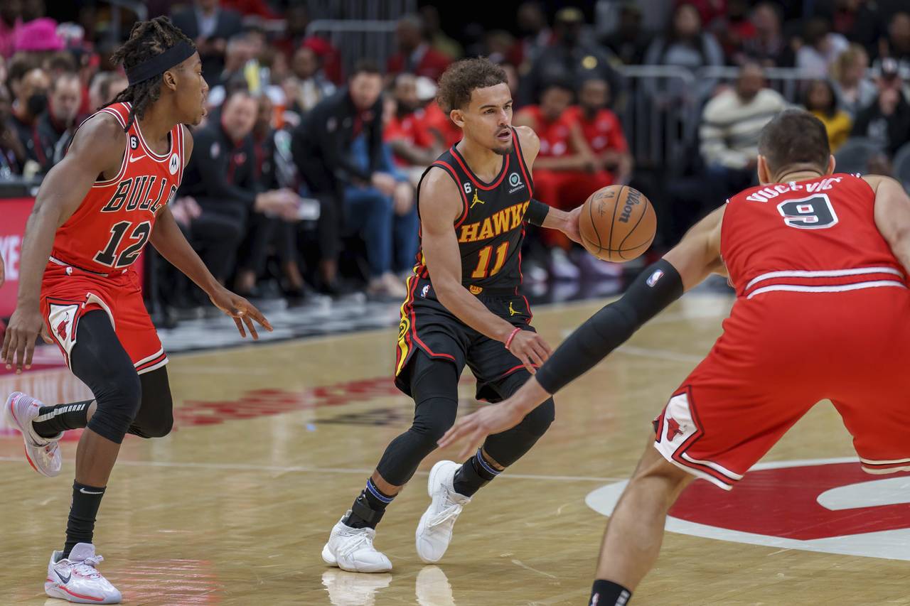 Atlanta Hawks guard Trae Young (11) dribbles the ball during the second half of an NBA basketball g...