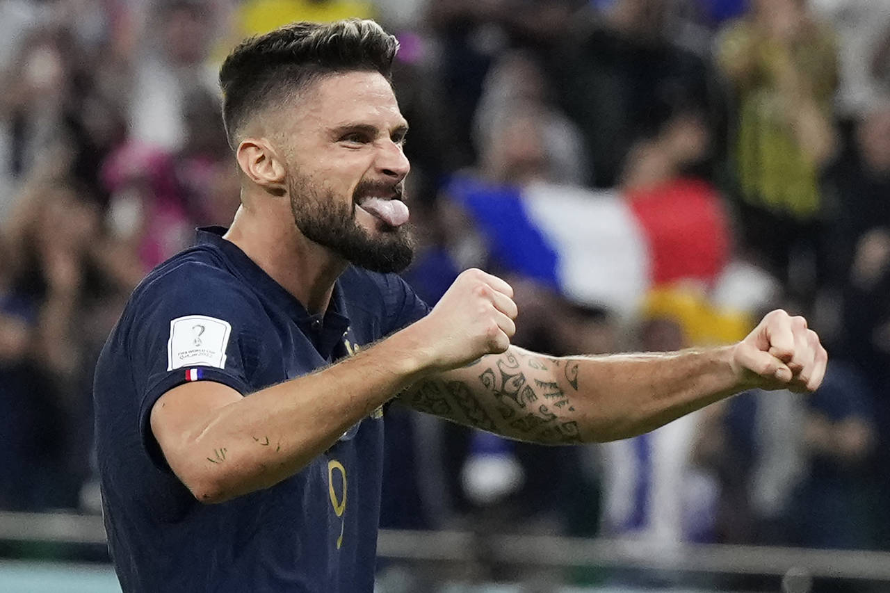 France's Olivier Giroud celebrates after Kylian Mbappe scored their side's second goal during the W...
