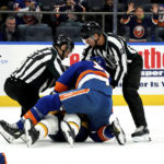 
              Referees separate New York Islanders left wing Matt Martin (17) and Nashville Predators right wing Michael McCarron, bottom, who fight during the second period of an NHL hockey game, Friday, Dec. 2, 2022, in Elmont, N.Y. (AP Photo/Julia Nikhinson)
            