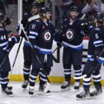 
              Winnipeg Jets' Sam Gagner (89) celebrates his goal against the Ottawa Senators with Josh Morrissey (44), Pierre-Luc Dubois (80), Kyle Connor (81) and Brenden Dillon (5) during the first period of an NHL hockey game Tuesday, Dec. 20, 2022, in Winnipeg, Manitoba. (Fred Greenslade/The Canadian Press via AP)
            
