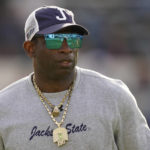 
              Jackson State head coach Deion Sanders surveys his players during warmups prior to the Southwestern Athletic Conference championship NCAA college football game against Southern University, Saturday, Dec. 3, 2022, in Jackson, Miss. (AP Photo/Rogelio V. Solis)
            