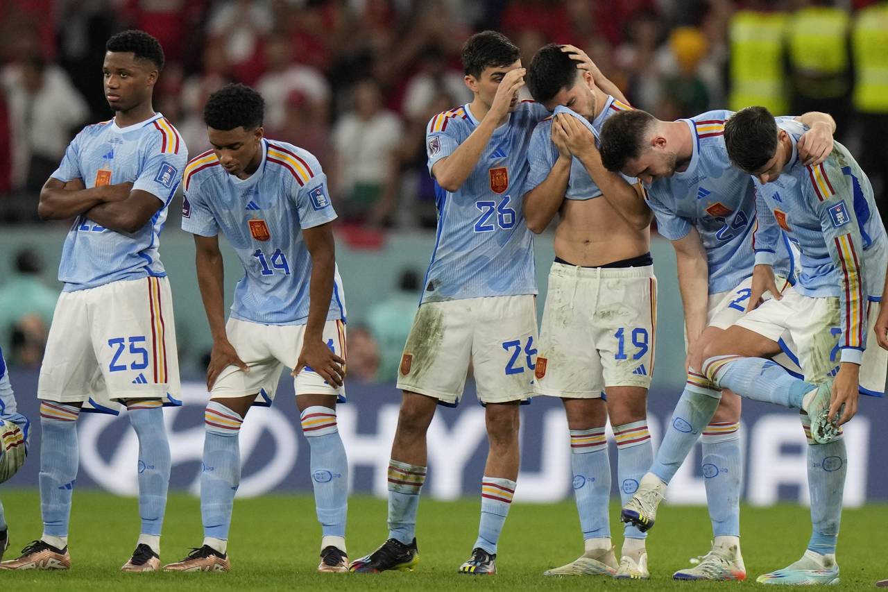 Spain's players react after the penalty shootout at the World Cup round of 16 soccer match between ...