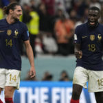 
              France's Adrien Rabiot, left, and France's Dayot Upamecano celebrate after the World Cup quarterfinal soccer match between England and France, at the Al Bayt Stadium in Al Khor, Qatar, Sunday, Dec. 11, 2022. (AP Photo/Frank Augstein)
            