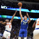 
              Dallas Mavericks guard Luka Doncic (77) shoots against New York Knicks guard Immanuel Quickley (5) during the first half of an NBA basketball game in Dallas, Tuesday, Dec. 27, 2022. (AP Photo/LM Otero)
            
