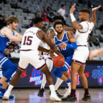 
              Boise State guard Marcus Shaver Jr. (10) is fouled by Texas A&M forward Henry Coleman III (15) during the first half of an NCAA college basketball game in Fort Worth, Texas, Saturday, Dec. 3, 2022. (AP Photo/Emil Lippe)
            