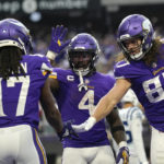 
              Minnesota Vikings wide receiver K.J. Osborn (17) celebrates with teammates Dalvin Cook (4) and T.J. Hockenson (87) after catching a 2-yard touchdown pass during the second half of an NFL football game against the Indianapolis Colts, Saturday, Dec. 17, 2022, in Minneapolis. (AP Photo/Abbie Parr)
            