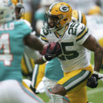 
              Green Bay Packers cornerback Keisean Nixon (25) runs with the ball during the first half of an NFL football game against the Miami Dolphins, Sunday, Dec. 25, 2022, in Miami Gardens, Fla. (AP Photo/Jim Rassol)
            