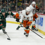 
              Anaheim Ducks right wing Frank Vatrano (77) skates past Minnesota Wild center Connor Dewar (26) during the second period of an NHL hockey game Saturday, Dec. 3, 2022, in St. Paul, Minn. The Wild win 5-4 in a shootout. (AP Photo/Craig Lassig)
            