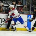 
              Montreal Canadiens' Joel Armia (40) controls the puck against Arizona Coyotes' Zach Kassian (44) in the first period during an NHL hockey game, Monday, Dec. 19, 2022, in Tempe, Ariz. (AP Photo/Darryl Webb)
            