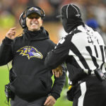 
              Baltimore Ravens head coach John Harbaugh meets with side judge Boris Cheek (41) during the first half of an NFL football game, Saturday, Dec. 17, 2022, in Cleveland. (AP Photo/David Richard)
            