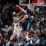 
              Indiana Pacers forward Isaiah Jackson, left, has a shot blocked by Portland Trail Blazers forward Drew Eubanks during the second half of an NBA basketball game in Portland, Ore., Sunday, Dec. 4, 2022. (AP Photo/Craig Mitchelldyer)
            