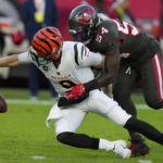 
              Cincinnati Bengals quarterback Joe Burrow (9) fumbles after being hit by Tampa Bay Buccaneers linebacker Lavonte David (54) during the first half of an NFL football game, Sunday, Dec. 18, 2022, in Tampa, Fla. Burrow recovered his fumble. (AP Photo/Chris O'Meara)
            