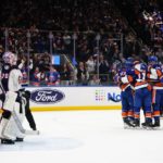 
              The New York Islanders celebrate a goal by Jean-Gabriel Pageau on Columbus Blue Jackets goaltender Joonas Korpisalo during the second period of an NHL hockey game Thursday, Dec. 29, 2022, in Elmont, N.Y. (AP Photo/Frank Franklin II)
            