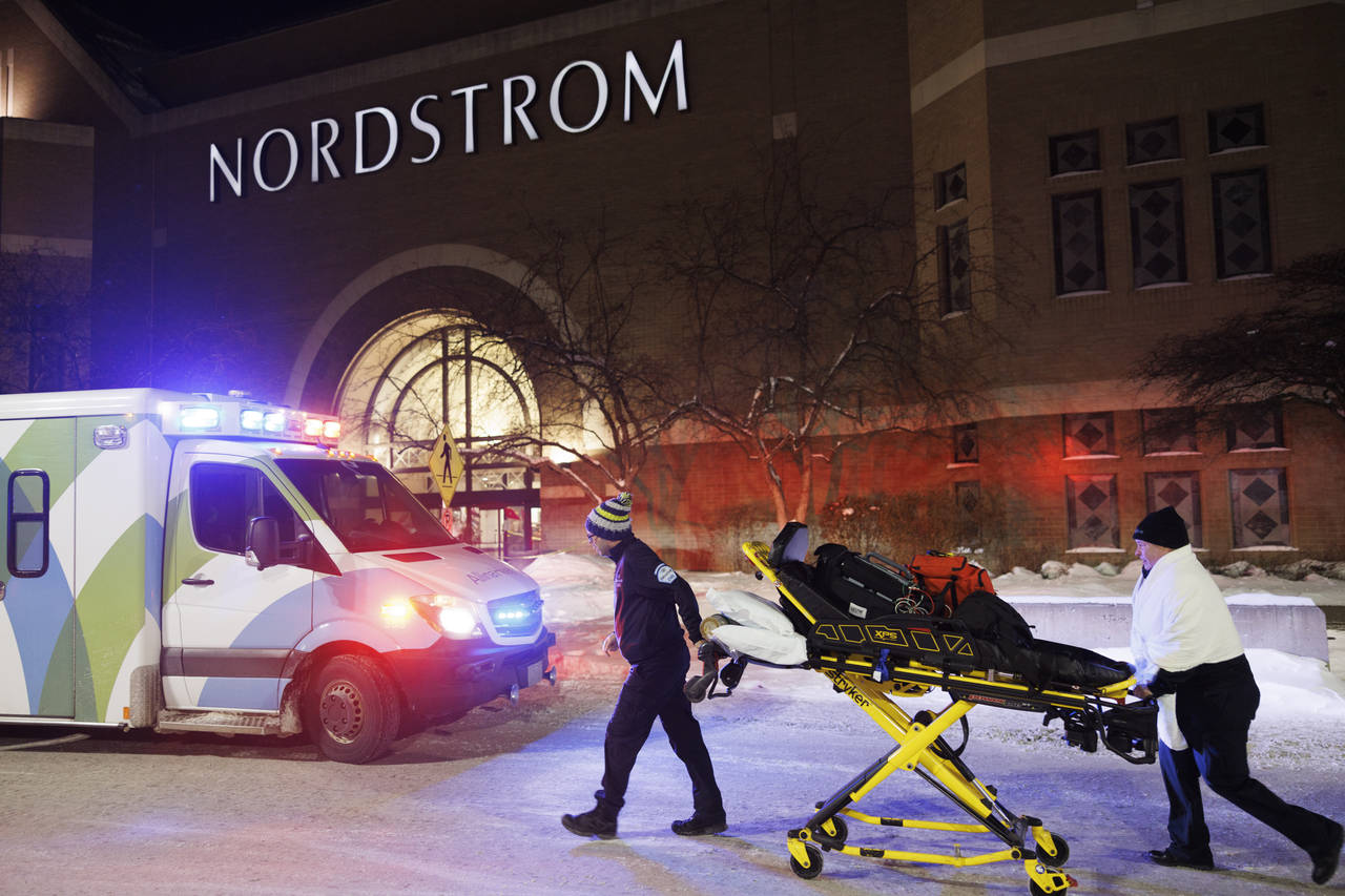 Two first responders and an ambulance are seen at the entrance to Nordstrom at the Mall of America ...